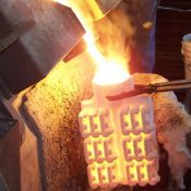Shells are removed from the ovens and filled with molten metal.